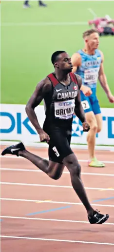  ??  ?? On track: Adam Gemili wins his 200m semi-final, ahead of Ramil Guliyev of Turkey and Canada’s Aaron Brown