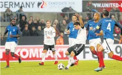  ?? EPA ?? Germany’s Lars Stindl scores to make it 2-2 against France in Cologne.