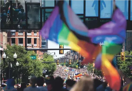  ?? PHOTOS BY COURTNEY HERGESHEIM­ER/ COLUMBUS DISPATCH ?? Thousands turned out Saturday for Stonewall Columbus’ Pride parade Downtown. It was the first in-person event since 2019 and a welcome sight for many.