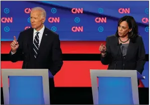  ?? The New York Times/ERIN SCHAFF ?? Joe Biden and Kamala Harris take part in the Democratic presidenti­al debate Wednesday in Detroit. Biden and Harris clashed over health care and other issues.