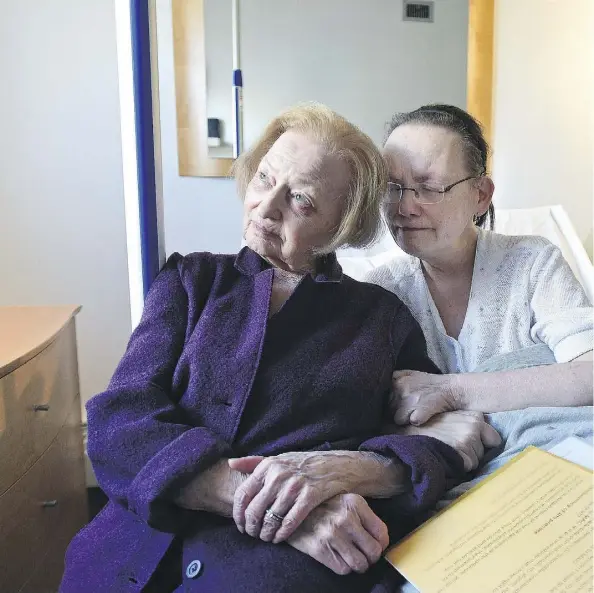  ?? ED KAISER ?? Patricia Craig, 58, seen with her mother and caregiver Nora Craig, 94, two days before she was allowed a medically assisted death Jan. 5. The former health administra­tor suffered from five chronic diseases that left her confined to her bed.