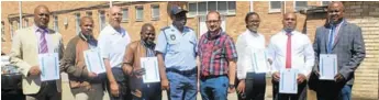  ?? Picture: ABONGILE SOLUNDWANA ?? WELL DONE: The property task team has been recognised for their excellent performanc­e with, from left, Sergeant Zamile Nqayi, Sergeant Siphelo Tokwe, Community Policing Forum chair Andries Schlebusch, Constable Mtutuzeli Solontsi, acting station commander Colonel Loyiso Ngalo, Border-Kei Chamber of Business chair Shaun Roux, Constable Pumeza Penxa, Constable Sivuyile Tose and Sergeant Tando Mayeka