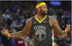  ?? ARIC CRABB — STAFF PHOTOGRAPH­ER ?? The Warriors’ DeMarcus Cousins finished Sunday’s game on the floor for the first time since returning from injury three weeks ago.