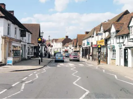  ??  ?? &gt; Knowle High Street, near Solihull, where free parking will be reduced from 60 minutes to 30 minutes