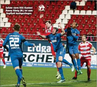  ??  ?? Gefahr vorm KSC-Kasten! Ronny König (M.) ist zum Kopfball hochgestie­gen.