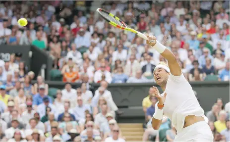  ?? TIM IRELAND/THE ASSOCIATED PRESS ?? Spain’s Rafael Nadal cranks a forehand at the Czech Republic’s Jiri Vesely during a fourth-round singles match at Wimbledon on Monday in London. Nadal won 6-3, 6-3, 6-4 and will face either No. 5 Juan Martin del Potro or Gilles Simon in the...