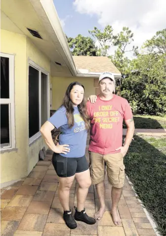  ?? MATIAS J. OCNER mocner@miamiheral­d.com ?? Kelly Coulter and her husband, Ray, at their home in West Palm Beach. When Ygrene pulled its funding, the Coulters were left with a $45,000 bill that was supposed to have been paid out through their tax bill.