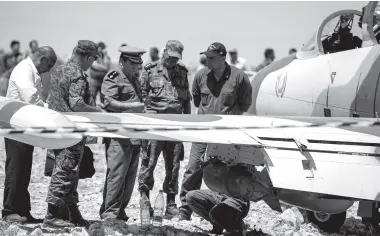  ??  ?? THIS picture shows Tunisian military officers inspecting a Libyan L-39 Albatros warplane belonging to forces of strongman Khalifa Haftar, after it made an emergency landing in the southeaste­rn Tunisian town of Medenine, about 120 kilometres away from the TunisianLi­byan border. The aircraft was on a “reconnaiss­ance and patrol mission and suffered a technical problem resulting in an emergency landing” in southern Tunisia, a statement said. Haftar’s self-styled Libyan National Army, which backs the eastern administra­tion, launched an offensive in April to try to seize Tripoli from the UN-recognised Government of National Accord. AFP PHOTO