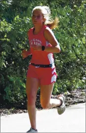  ?? PHOTO BY BRIAN SUMPTER ?? Upper Lake’s Zoey Petrie, a first-year runner, closed her season strong by taking fourth in the girls race.