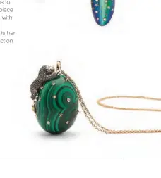  ??  ?? Lion on Malachite necklace in 18K rose gold, brown and white diamonds, and malachite