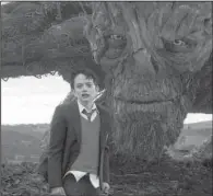  ??  ?? Conor O’ Malley ( Lewis MacDougall) is visited by an ambulatory yew tree ( voiced by Liam Neeson) in the dark fable A Monster Calls.