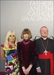  ?? DOMENICO STINELLIS — THE ASSOCIATED PRESS ?? Cardinal Gianfranco Ravasi, right, designer Donatella Versace, left, and Vogue Editor-in-Chief Anna Wintour pose for photos at Palazzo Colonna in Rome, Monday.