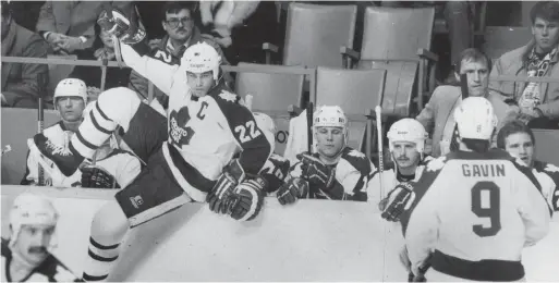  ?? FRANK LENNON TORONTO STAR FILE PHOTO ?? Leafs captain Rick Vaive hops the boards in a game against the St. Louis Blues at Maple Leaf Gardens in the spring of 1985.