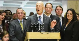  ?? MARK WALLHEISER / ASSOCIATED PRESS ?? Florida Gov. Rick Scott speaks after the end of the legislativ­e session Sunday at the state Capitol in Tallahasse­e as House Speaker Richard Corcoran (left) and Senate President Joe Negron look on.