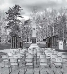  ?? Dan Hennessey ?? These empty chairs were once full and seated veterans from various conflicts, over the years, as veterans pass, the chairs are still set in front of the Bridgewate­r monument as a way to remember the fallen.