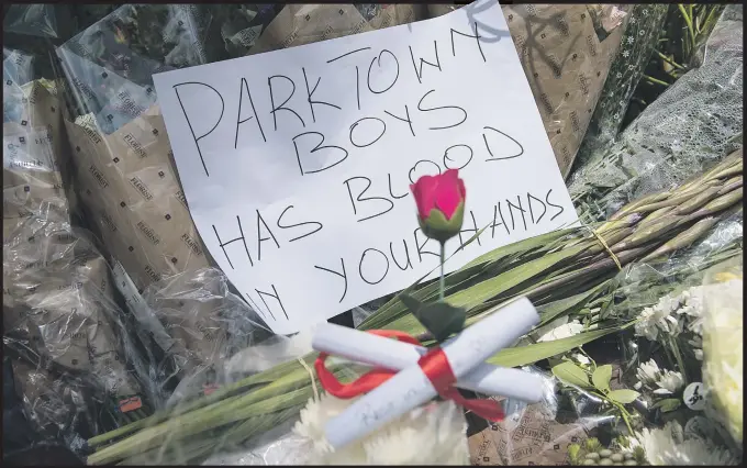  ?? Picture: Michel Bega ?? POIGNANT MESSAGE. The entrance to Parktown Boys’ High School yesterday, where people have laid flowers to remember Enoch Mpianzi who drowned last week while on a school orientatio­n camp.