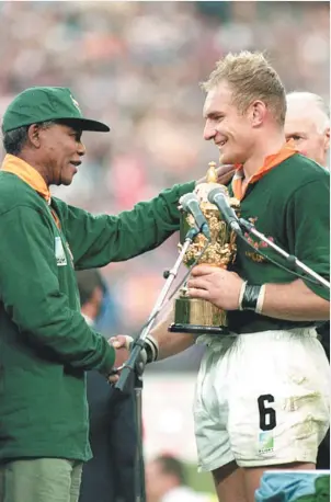  ?? PICTURE: Getty Images ?? Triumph: Francois Pienaar with Nelson Mandela in 1995