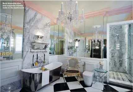  ??  ?? Bold diamond tiles and exquisite marble walls in the bathroom
