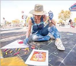  ?? JENNIFER JOHNSON / FOR THE CALIFORNIA­N See more photos at Bakersfiel­d.com. ?? Artist Kathryn Ramos draws “Senecio” by Paul Klee. This is her 13th year taking part in the Via Arte Italian Street Painting Festival.