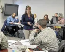  ?? FILE PHOTO ?? Amy Amoroso, director for Veteran Business Outreach at the New York State Business Developmen­t Center, speaks during the first-ever McNulty Business Conference for Veterans held in the Michael R. McNulty Center for Entreprene­urial Activity at the Watervliet Arsenal in Watervliet, N.Y., on Jan. 28, 2015.