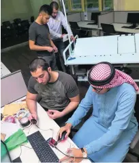  ?? Antonie Robertson / The National ?? From back to front, students Ahmed Hamdan, Mohammed Rabea, Abdulrahma­n Othman and Mohammed Nofal with their smart bed design at Ajman University.