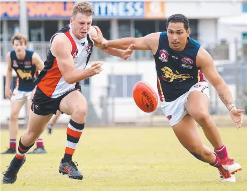  ?? Picture: JUSTIN BRIERTY ?? PLENTY OF PRIDE: Saints’ Joel Newman and Lions’ Tobias Fatnowna compete for the ball at Manunda.