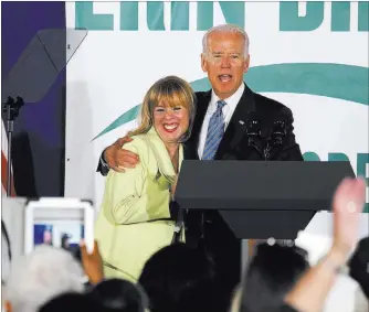  ?? JASON BEAN/ LAS VEGAS REVIEW-JOURNAL ?? Vice President Joe Biden shows his support for 3rd Congressio­nal District candidate Erin Bilbray on Wednesday during a campaign rally at the Henderson Convention Center. The rally drew nearly 300 Democratic backers.