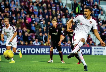  ??  ?? At the double: Sow spot on for his second of the night as Hearts find their goal rhythm after a slow start