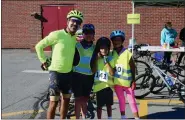  ?? SUBMITTED PHOTO — JARED COFFIN ?? Families rode together during the 13th annual Brake the Cycle of Poverty Benefit Bike Ride for Friend Inc. Community Services on Aug. 13.