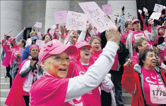  ?? DISPATCH ?? ERIC ALBRECHT Karee Van Runkle, 54, of New Albany, celebrates with other cancer survivors at the survivor ceremony on the Statehouse steps.