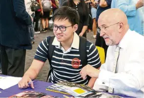  ??  ?? The University of Liverpool’s Prof John Williams (right) shares insights on studying in the UK during the BAC Law Expo.