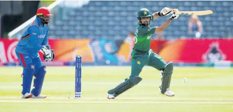  ?? AP ?? Pakistan’s Babar Azam (right) plays a shot as Afghanista­n’s Mohammad Shahzad watches during the teams’ Cricket World Cup warmup match at The Bristol County Ground in Bristol, England, yesterday.