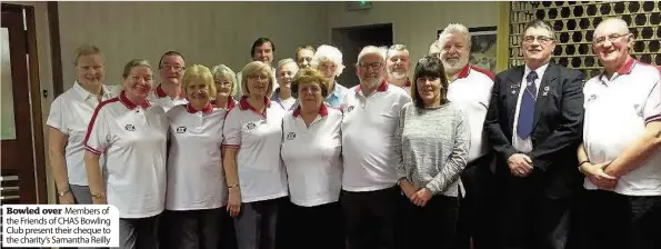  ??  ?? Bowled over Members of the Friends of CHAS Bowling Club present their cheque to the charity’s Samantha Reilly