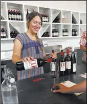  ?? Sally Carpenter Hale The Associated Press ?? A server pours a wine tasting at COR Cellars in Lyle, Wash.