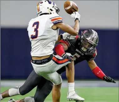  ?? Photo submitted by the Star-Telegram/STEVE NURENBERG ?? Arkansas freshman Jalen Catalon (right), here putting a hit on Frisco (Texas) Wakeland’s Tre Adams while competing for Mansfield (Texas) Legacy in a 2017 game, is eager to get back on the field after missing most of his senior season with a torn ACL.