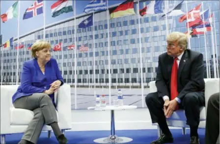  ?? PABLO MARTINEZ MONSIVAIS — THE ASSOCIATED PRESS ?? President Donald Trump and German Chancellor Angela Merkel during their bilateral meeting Wednesday in Brussels, Belgium.