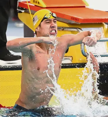  ??  ?? Impressive feat: Anas Zul Amirul Sidi celebratin­g after winning the men’s 100m freestyle S14 gold at National Aquatics Centre in Bukit Jalil on Tuesday.