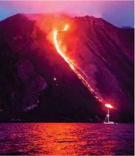  ??  ?? Spectacle: Lava flows into sea from Italian volcano Stromboli