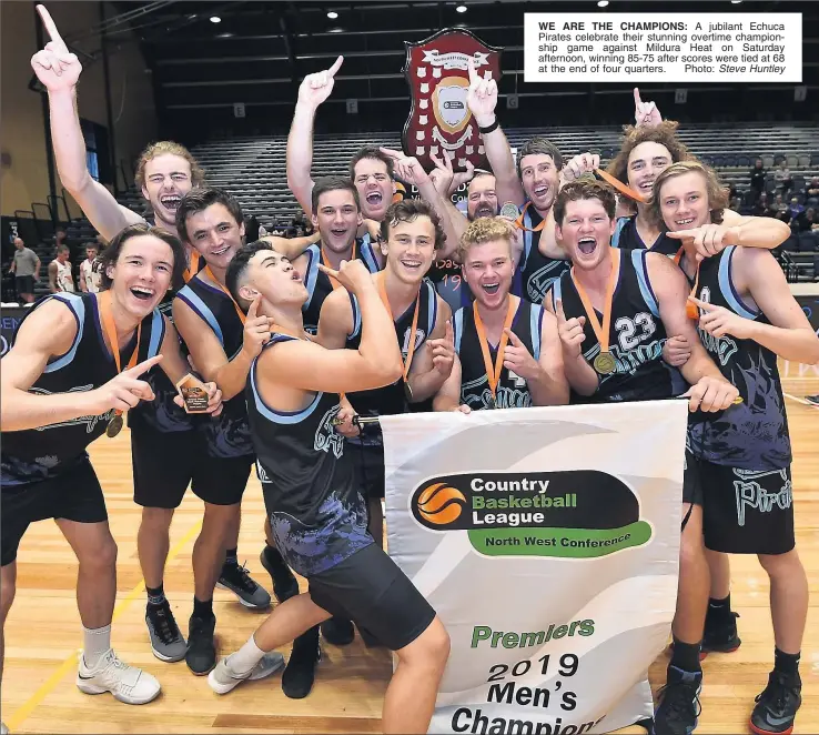  ?? Photo: Steve Huntley ?? WE ARE THE CHAMPIONS: A jubilant Echuca Pirates celebrate their stunning overtime championsh­ip game against Mildura Heat on Saturday afternoon, winning 85-75 after scores were tied at 68 at the end of four quarters.