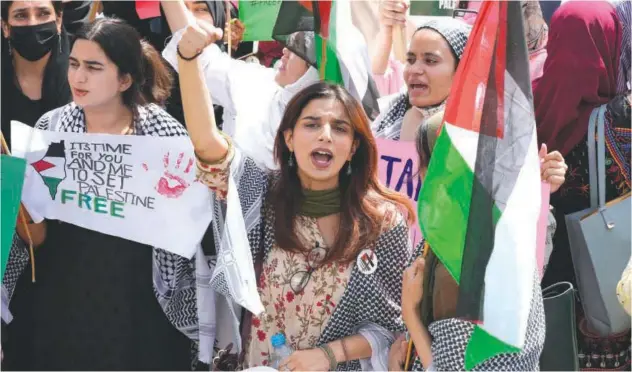  ?? Associated Press ?? ↑
University students take part in a rally against Israeli airstrikes on Gaza and to show solidarity with Palestinia­n people, in Lahore, Pakistan.