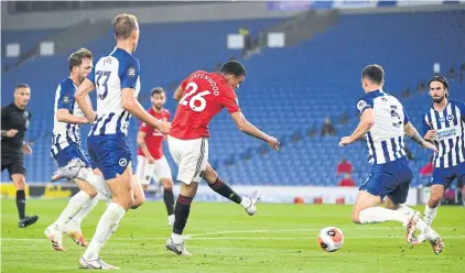  ??  ?? Manchester United’s Mason Greenwood scores against Brighton during a Premier League game on Tuesday.