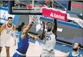  ?? DAVID BUTLER II/POOL PHOTO/AP PHOTO ?? UConn forward Adama Sanogo (21) shoots against Seton Hall during the first half of Saturday afternoon’s game at Gampel Pavilion in Storrs.