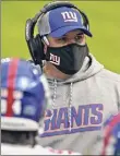  ?? Photos from Associated Press ?? The Giants’ Joe Judge, left, is a rookie head coach during a pandemic. The seat is likely hotter for the Jets’ Adam Gase.