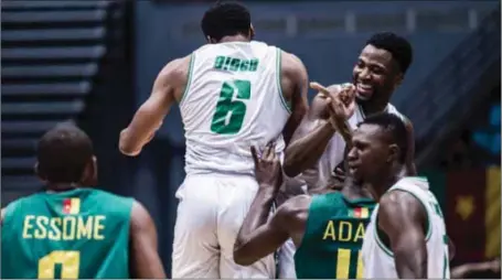  ??  ?? D’Tigers’ Ike Diogu (2nd left) and his teammates celebratin­g the semi final qualificat­ion at the ongoing 2017 Afrobasket Championsh­ips in Tunisia… yesterday