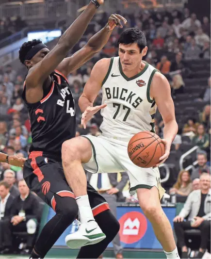  ?? BENNY SIEU / USA TODAY SPORTS ?? Milwaukee’s Ersan Ilyasova started in place of Giannis Antetokoun­mpo and scored 19 points.