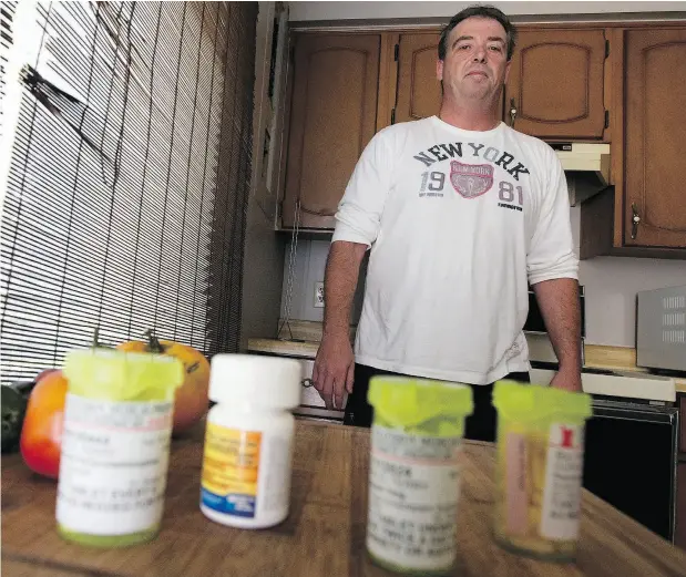  ?? CRAIG GLOVER / POSTMEDIA NEWS FILES ?? Cab driver Terry Duffield at his Strathroy, Ont., home in August 2016, with a collection of medication he had been taking since being caught earlier that month in a police takedown of ISIL sympathize­r Aaron Driver. “Terry was quite the lamb tied to the...