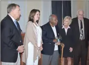  ?? Diane Wagner / RN-T ?? J.L. Vaughn Jr. (center), a local civil rights leader and first black principal in Floyd County’s integrated school system, is recognized by the County Commission on Tuesday.