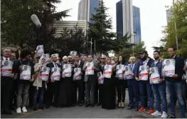  ?? — AP ?? Members of the Turkish- Arab Journalist Associatio­n hold posters with photos of missing Saudi writer Jamal Khashoggi as they hold a protest near the Saudi Arabia consulate in Istanbul on Monday.