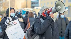  ?? JASON FRANSON THE CANADIAN PRESS ?? Hospital workers in Edmonton walk a picket line Monday during a wildcat strike. Hundreds participat­ed in the strikes, the latest salvo in a bitter dispute between government and workers.