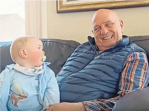  ?? Football. ?? MANAGING THE SITUATION: Proud grandad Dick Campbell, with Rian, says he is lucky to have worked in